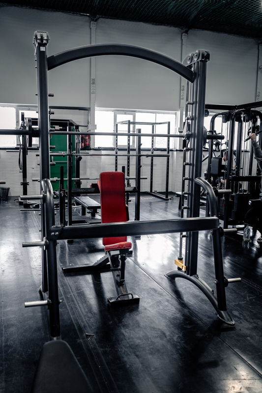 Multi-functional rack with adjustable bench at Strength Factory